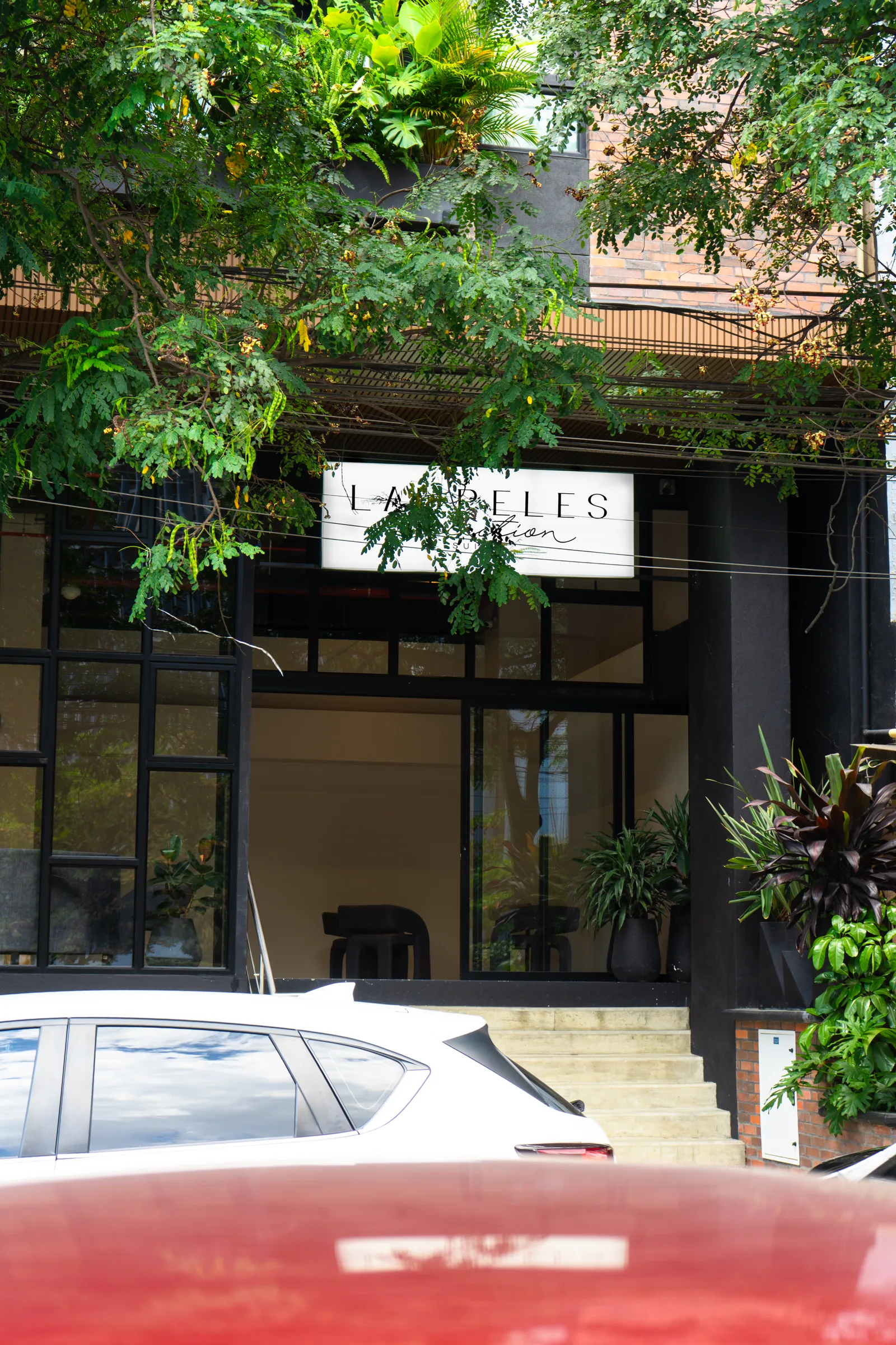 Área de estar de uma suite no Laureles Selection Suites